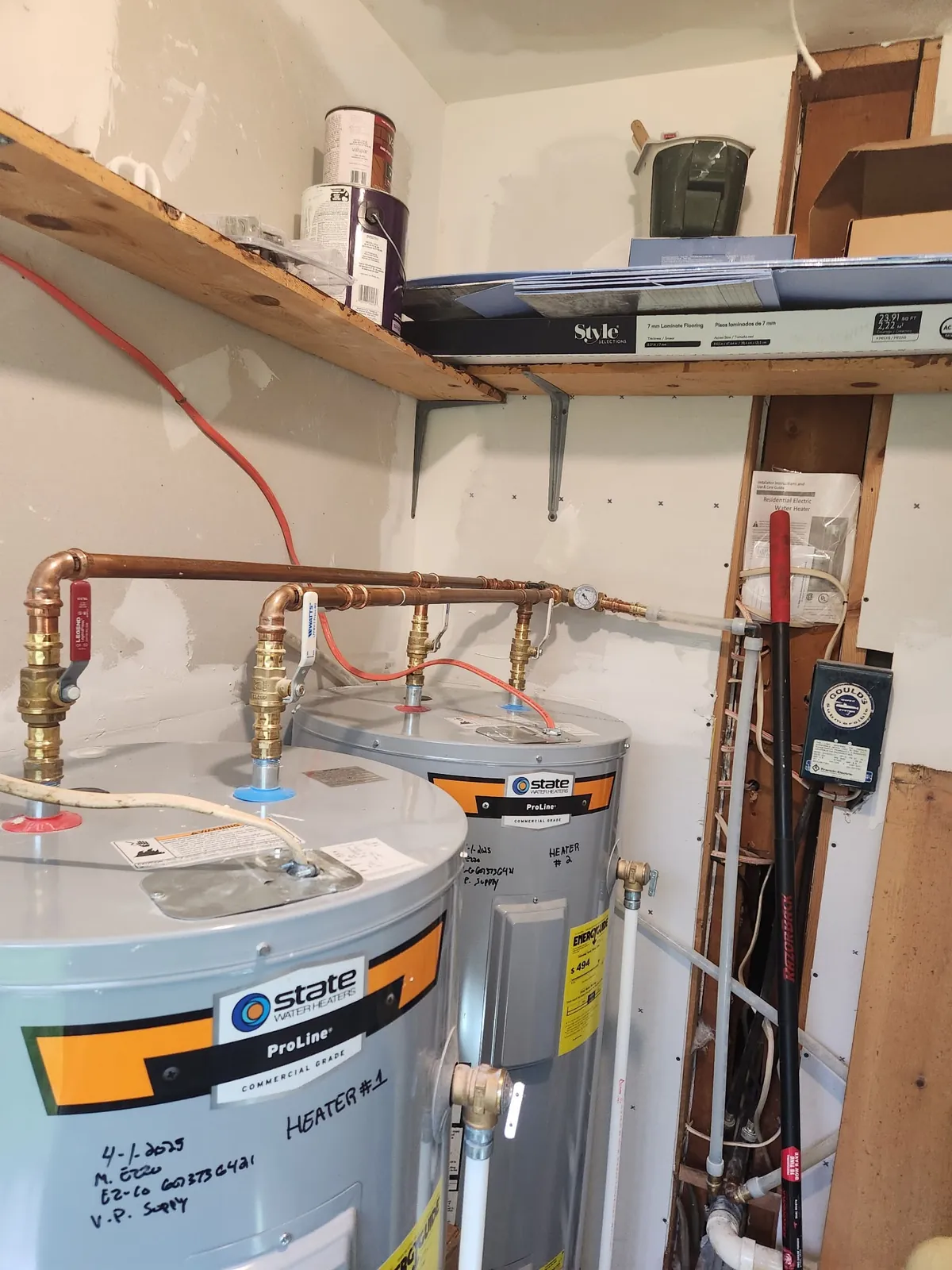 Two State ProLine electric water heaters piped in parallel with copper headers and isolation valves