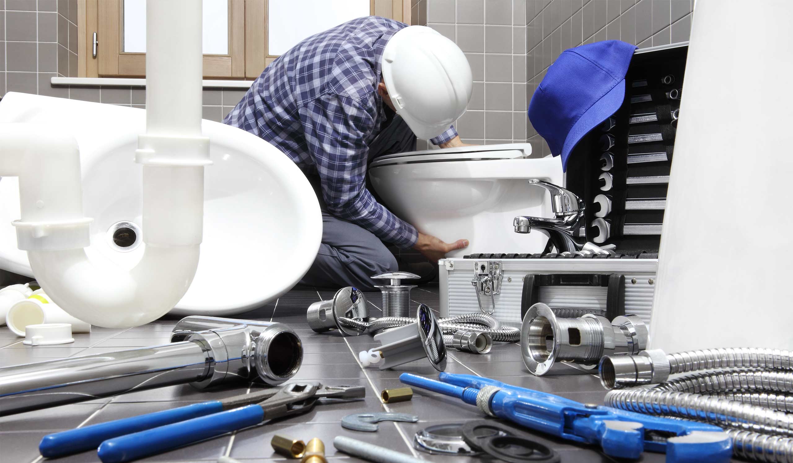 plumber installing new toilet at bathroom as a replacement sherburne ny