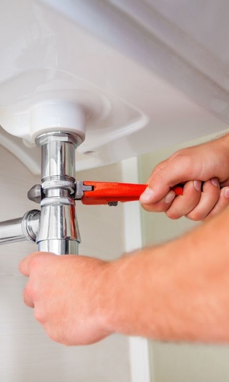 plumber fixing a sink sherbune ny
